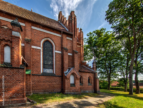 Fototapeta Naklejka Na Ścianę i Meble -  General view and architectural details of the Neo-Gothic Catholic Church of St. Joseph in Kobułty, Masuria, Poland.