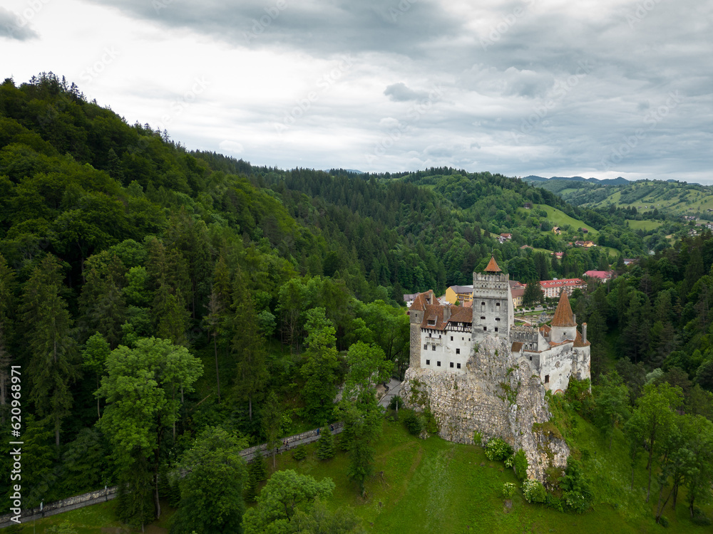 Medieval Bran Castle, aerial drone perspective. Known as Dracula's Castle, it is visited annually by many foreign tourists. One of the best-known tourist attractions of Romania