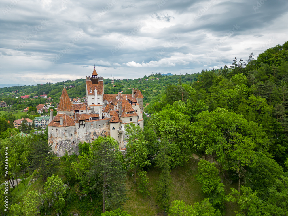 Medieval Bran Castle, aerial drone perspective. Known as Dracula's Castle, it is visited annually by many foreign tourists. One of the best-known tourist attractions of Romania
