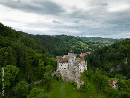 Medieval Bran Castle  aerial drone perspective. Known as Dracula s Castle  it is visited annually by many foreign tourists. One of the best-known tourist attractions of Romania