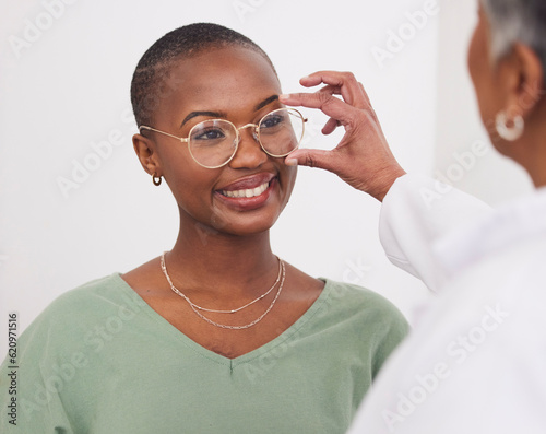 Black woman, glasses and vision, eye care and health with optometry, doctor and patient with prescription lens and frame. Ophthalmology, focus and eyewear with female people in optometrist clinic