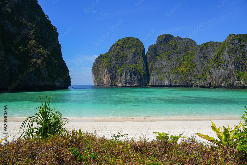 Maya Bay, an amazing beach with white sand and turquoise waters surrounded with limestone cliffs on Koh Phi Phi Leh island, Krabi Province, Thailand. The place was made famous by the movie 