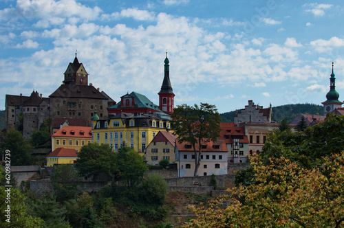 Scenic landscape view of ancient Loket castle in Czech Republic. Famous touristic place and romantic travel destination. Romantic castle with colorful houses. UNESCO World Heritage Site