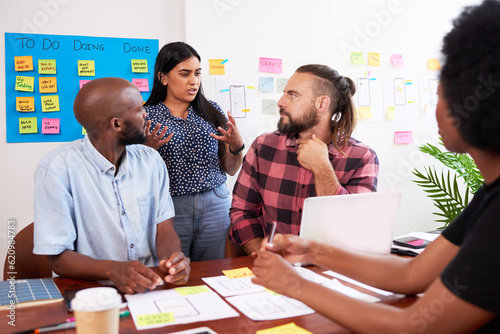 Developers have heated discussion while planning new app, tech start up meeting