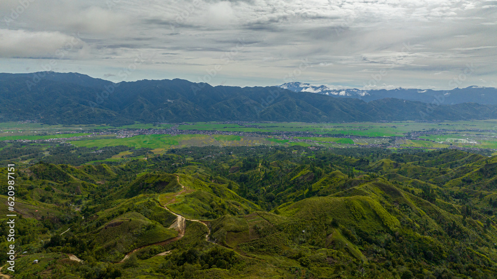 Mountains and agricultural land in a mountainous province. Kayu Aro, Sumatra, Indonesia.