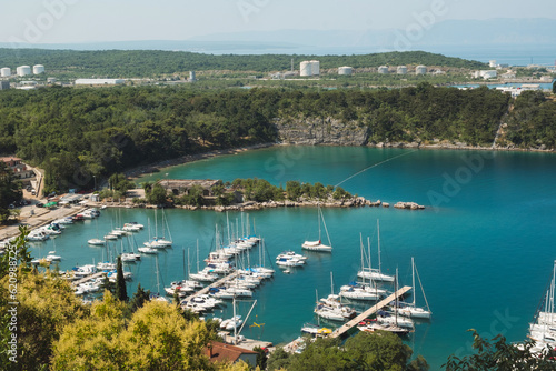 Beautiful panoramic seascape of Adriatic sea marina, yachts and old walls of Krk town on Croatia island Krk