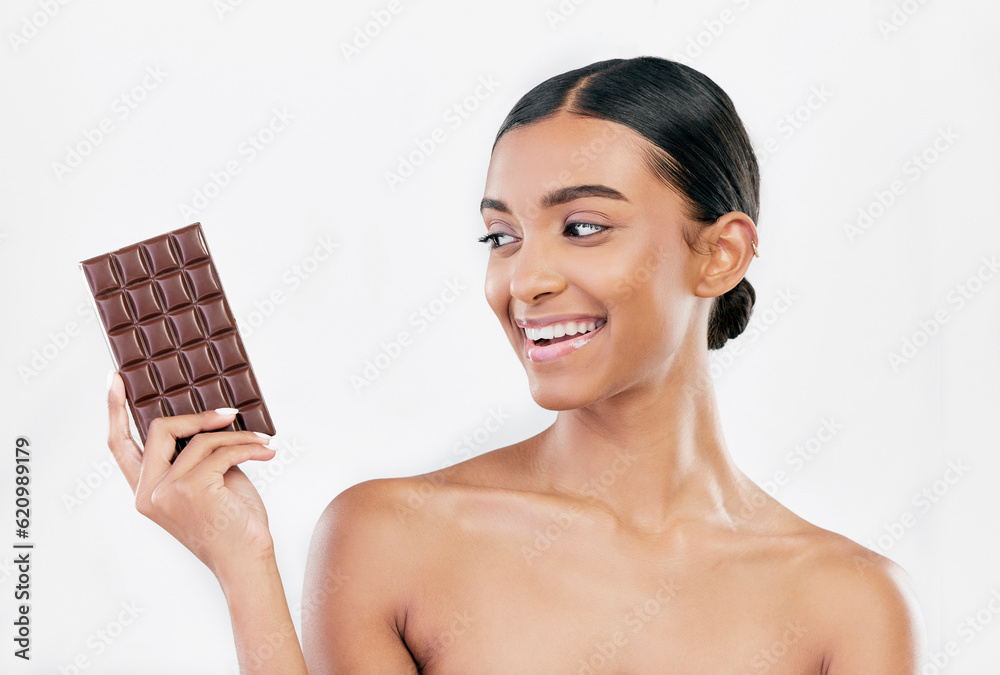 Happy woman, chocolate and sweet candy for diet or unhealthy food against a white studio background. Female person or model with cocoa slab, block or bar for delicious snack or diabetes on mockup Happy woman, chocolate and sweet candy for diet or unhealthy food against a white studio background. Female person or model with cocoa slab, block or bar for delicious snack or diabetes on mockup