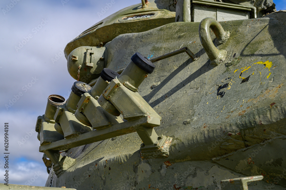 Close-up of the turret rocket launchers of an old tank, armored car, military green, M60 patton of the American army in Europe and later of the Spanish army