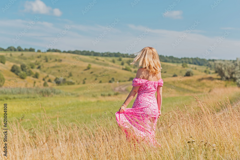 Romantic woman, natural women beauty. Lady at nature, pretty European lady in pink dress Romantic woman, natural women beauty. Lady at nature, pretty European lady in pink dress