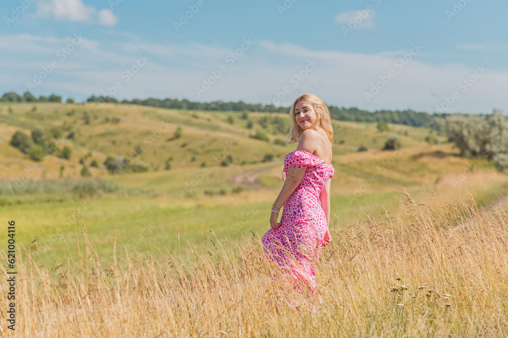 Romantic woman, natural women beauty. Lady at nature, pretty European lady in pink dress Romantic woman, natural women beauty. Lady at nature, pretty European lady in pink dress
