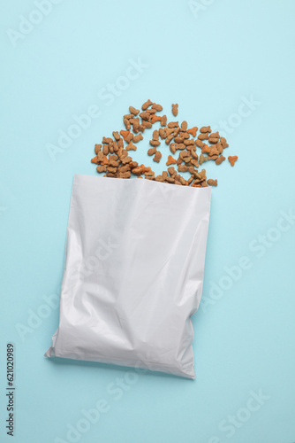 Mockup of a white package of dry cat food on a blue background