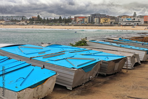 Tableau sur toile Small fishing boats on the shore at Ben Buckler Point in North Bondi Beach