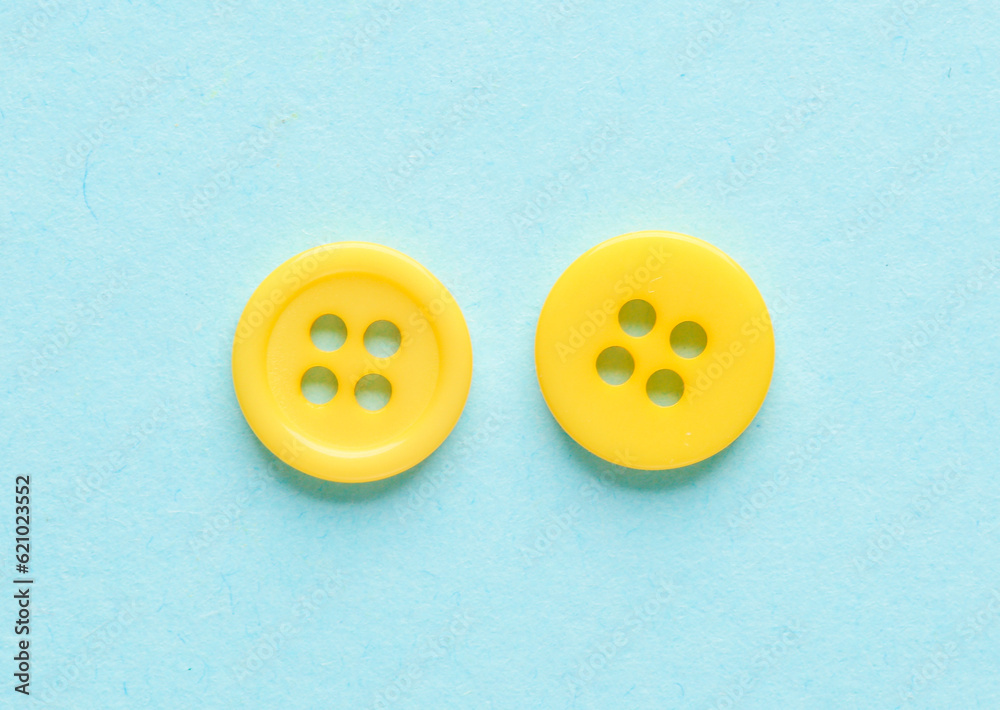 Two yellow buttons on a blue background Two yellow buttons on a blue background