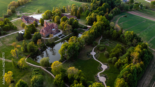 Jaunmoku medieval brick castle complex with pond and park near Tukums, Latvia, drone view © ako-photography