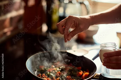 Fototapeta na wymiar Young woman cooking in the kitchen