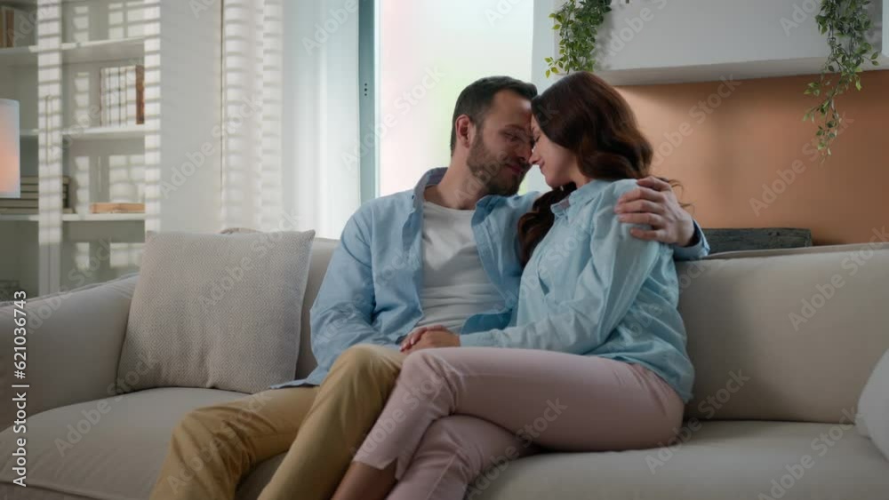 Caucasian married couple in love man and woman cuddling touch forehead at home couch sofa noses kiss touching faces hugging tender cute moment affectionate spouses boyfriend girlfriend cuddling bond Caucasian married couple in love man and woman cuddling touch forehead at home couch sofa noses kiss touching faces hugging tender cute moment affectionate spouses boyfriend girlfriend cuddling bond