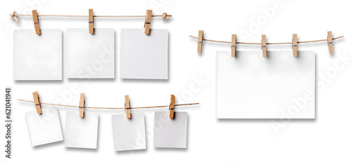 White blank empty paper sheet attached with wooden wood pegs on string on transparent background cutout, PNG file. Mockup template for artwork design. Many assorted different sets varieties
