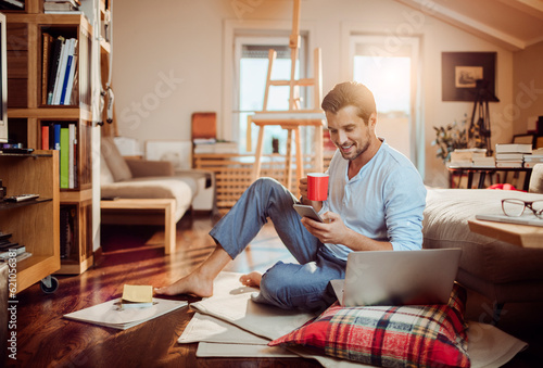 Young man using a smart phone in the morning at home