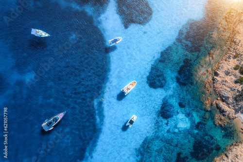 Aerial view of luxury yachts and boats on blue sea at sunny day