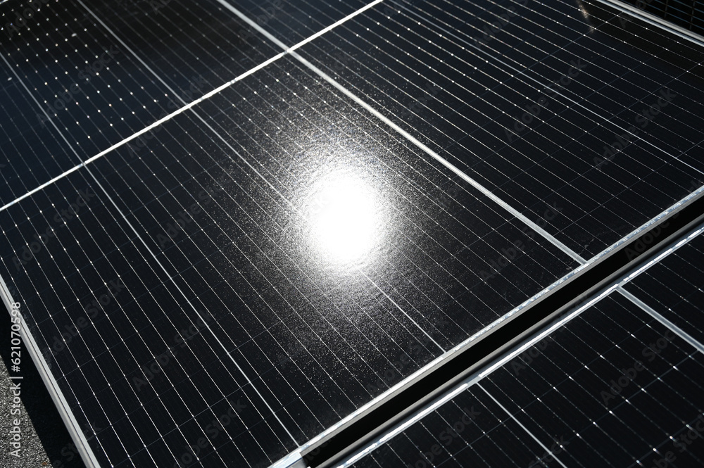 Green energy, solar panels on the roof of the house