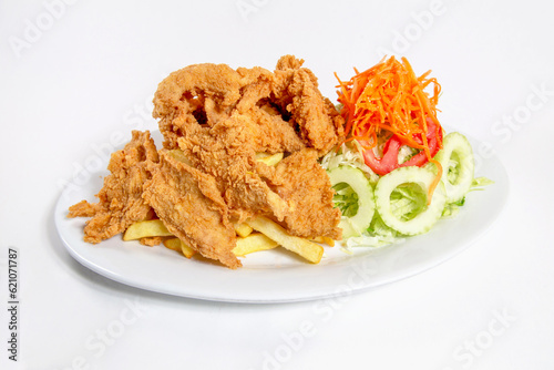 Chicharron fish with vegetable salad, delicious Peruvian food photo