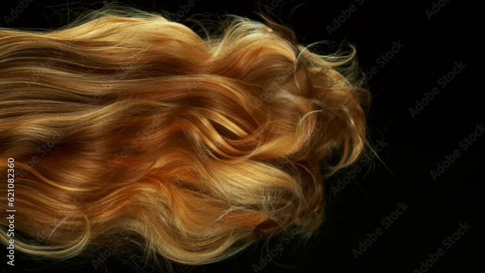 Super slow motion of wavy red hair in detail. Filmed on high speed cinema camera, 1000 fps. Isolated on black background. Super slow motion of wavy red hair in detail. Filmed on high speed cinema camera, 1000 fps. Isolated on black background.