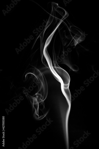Coloured smoke. Black background. Colourful smoke images. Abstract photographs of smoke.