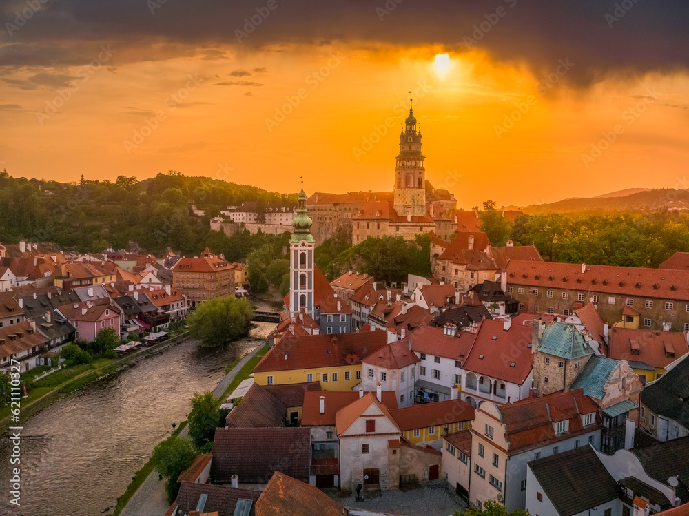 Cesky Krumlov medieval town castle with orange sunset sky