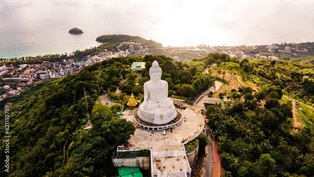 Phuket Big Buddha statue. afternoon light sky and blue ocean are on the back of white Phuket big Buddha is the one of landmarks on Phuket island Thailand.