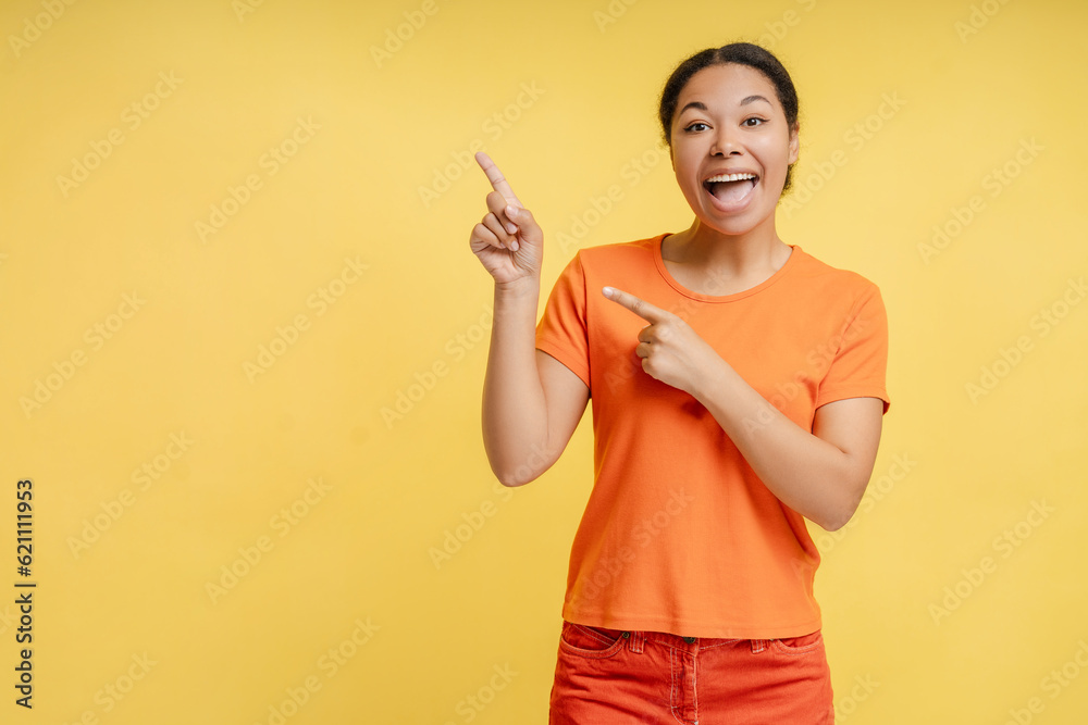Portrait of attractive confident african american woman pointing finger isolated Portrait of attractive confident african american woman pointing finger isolated