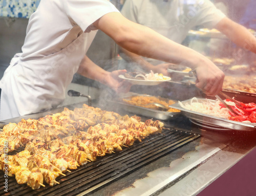 
meat and chicken dishes on the grill
