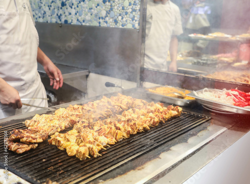 
meat and chicken dishes on the grill