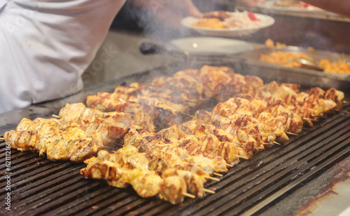 
meat and chicken dishes on the grill