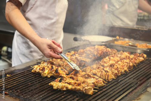 
meat and chicken dishes on the grill