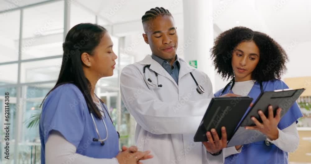 Healthcare, tablet and a doctor talking to nurses in the hospital for teamwork or planning treatment. Medical, meeting and discussion with a professional medicine team in a clinic for strategy Healthcare, tablet and a doctor talking to nurses in the hospital for teamwork or planning treatment. Medical, meeting and discussion with a professional medicine team in a clinic for strategy