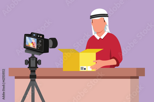 Cartoon flat style drawing young Arab male vlogger unboxing, review product live on youtube in studio. Social media influencer recording unboxing video at home logo. Graphic design vector illustration