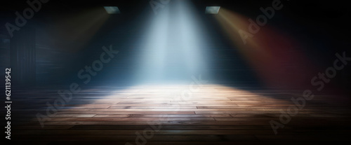 Spotlight with bright light on dark wood floor