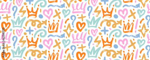 Brush drawn multi colored doodle shapes seamless pattern. Hearts, crowns, arrows, crosses, swirls and dots with dry brush texture. Colorful banner background with trendy graffiti style elements.