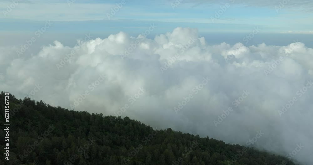 Multiple layers of clouds. View of Agung volcano slope in Bali island. Multiple layers of clouds. View of Agung volcano slope in Bali island.