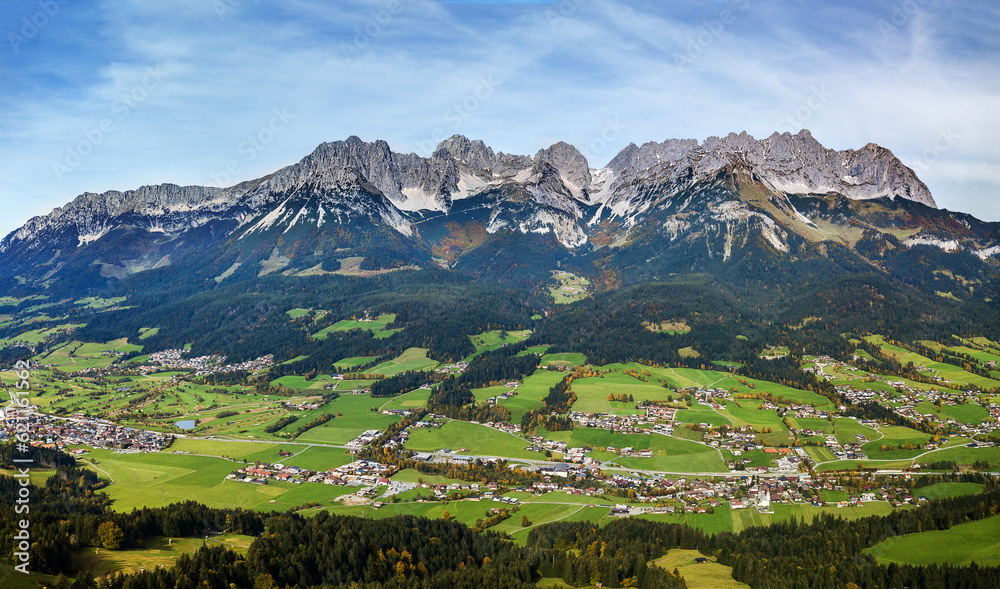 Panorama aerial image of valleys and the famous Wilder Kaiser mountain range, Kitzbuehel, Tyrol, Austria - obrazy, fototapety, plakaty 