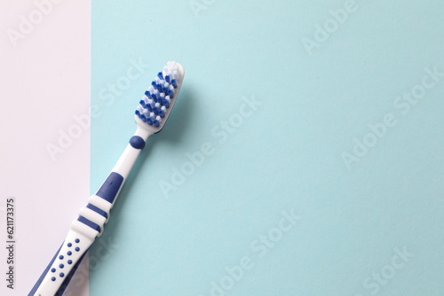 toothbrush on a blue background  close-up  flat lay. Dentistry and healthcare concept
