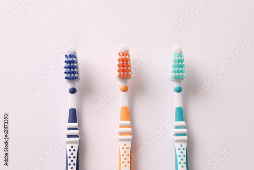 toothbrushes on a white background  close-up  flat lay. Dentistry and healthcare concept