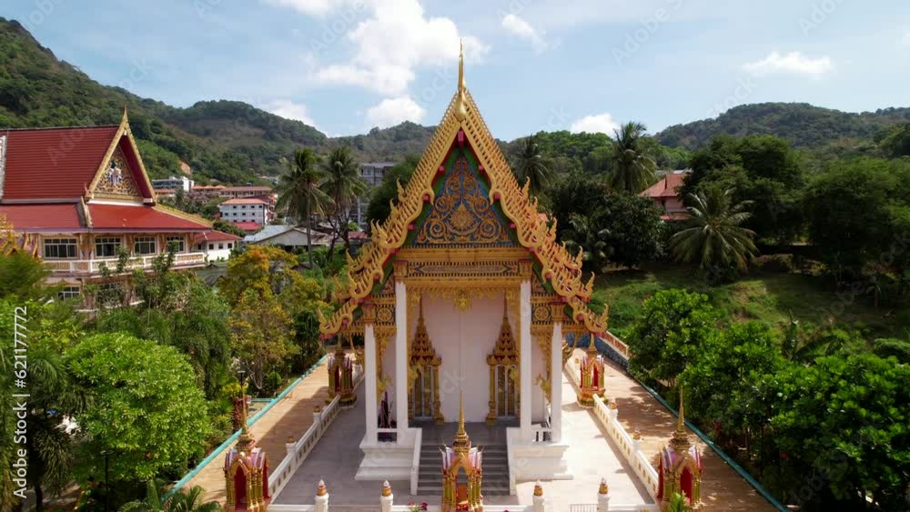Aerial view of Karon wat temple and green hills, trees, religion, buddhism. Historical buildings, religion, culture and traditions of Thailand, golden decorations and sculptures, life in Phuket Aerial view of Karon wat temple and green hills, trees, religion, buddhism. Historical buildings, religion, culture and traditions of Thailand, golden decorations and sculptures, life in Phuket