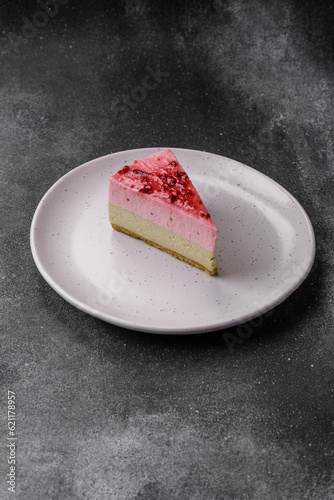 Delicious sweet dessert cheesecake with raspberry and pistachio flavor