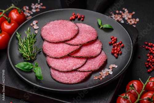 Delicious smoked salami sausage with salt, pepper, spices and herbs