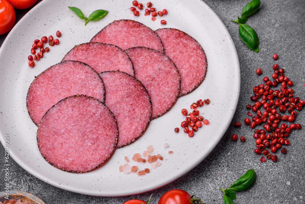 Delicious smoked salami sausage with salt, pepper, spices and herbs Delicious smoked salami sausage with salt, pepper, spices and herbs