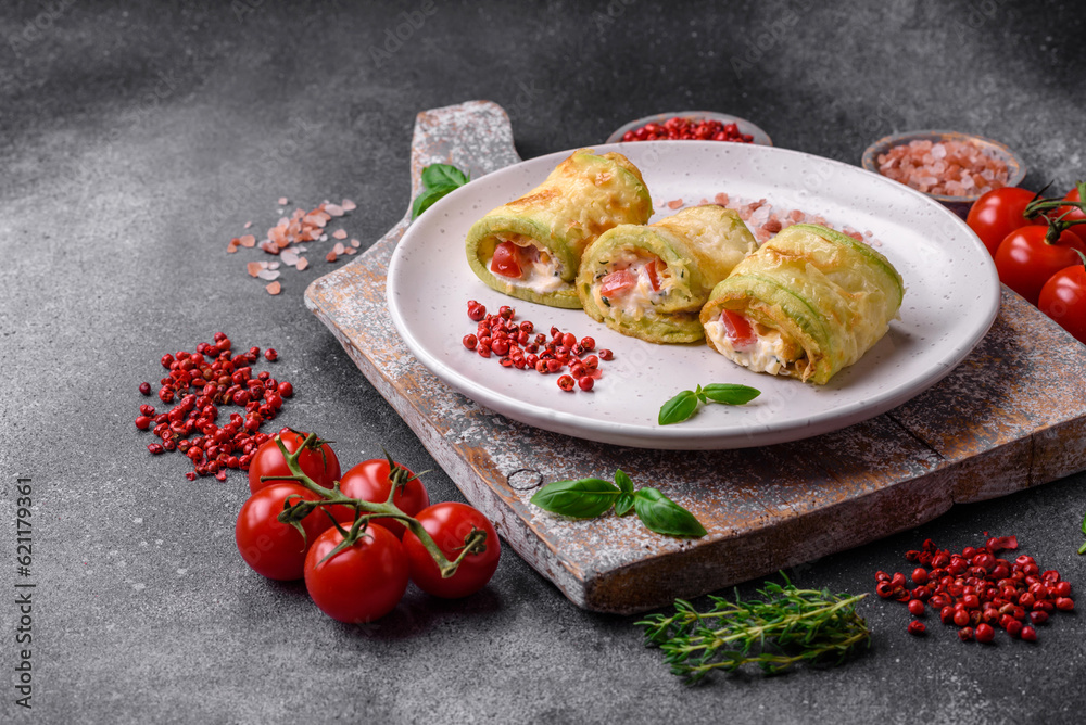 Delicious healthy vegetarian vegetable roll of zucchini, tomatoes, peppers and sauce Delicious healthy vegetarian vegetable roll of zucchini, tomatoes, peppers and sauce