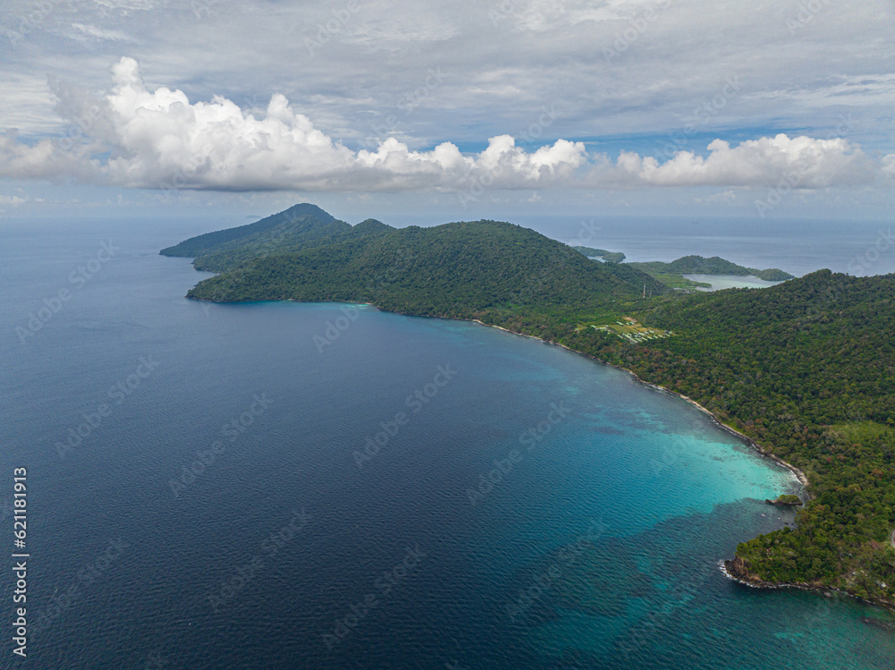 Top view of coast of the island of Weh with bays and lagoons. Tropical landscape. Aceh, Indonesia. Top view of coast of the island of Weh with bays and lagoons. Tropical landscape. Aceh, Indonesia.