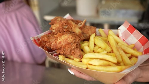 Chicken and fries meal ready to be served to a customer