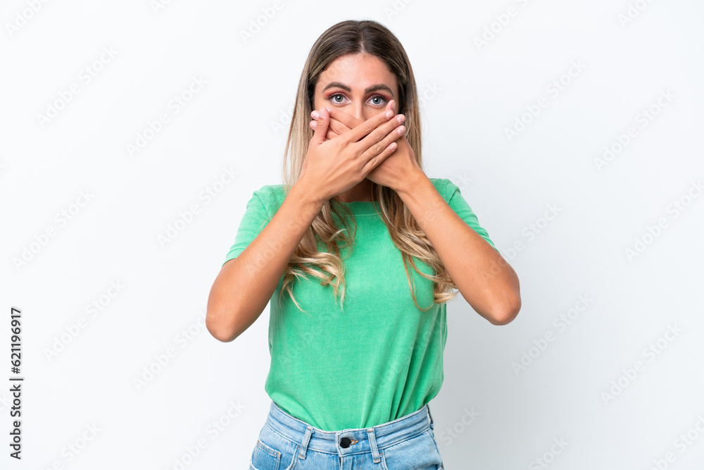 Young Uruguayan woman isolated on white background covering mouth with hands Young Uruguayan woman isolated on white background covering mouth with hands
